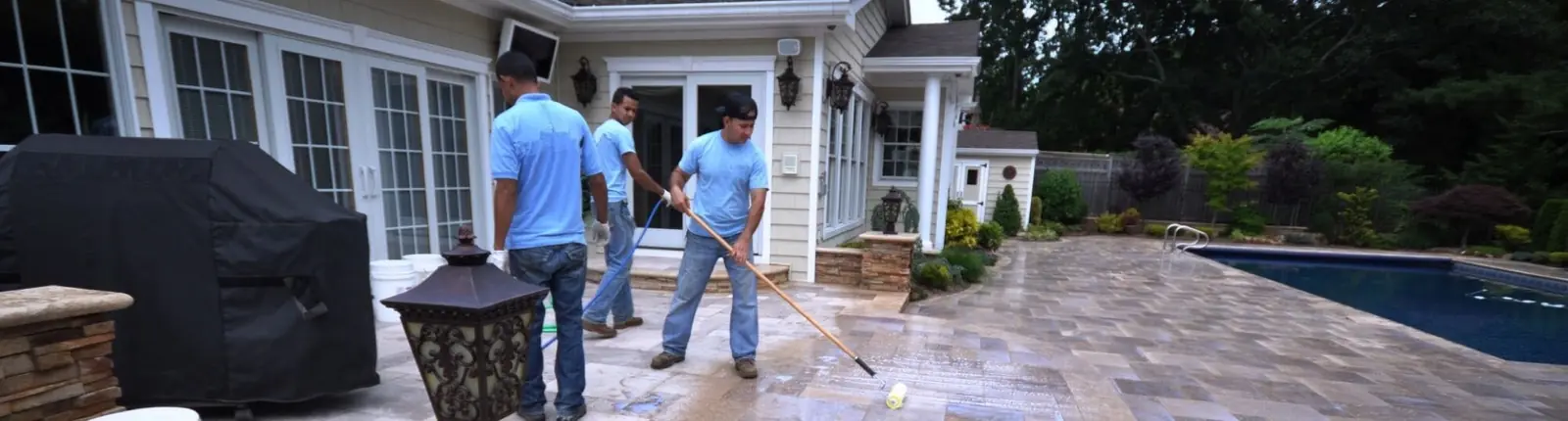 Two team members discussing a pool renovation on site